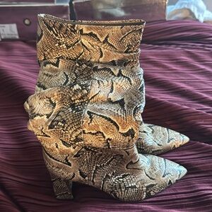 Vince Camuto snake skin boots new never worn.